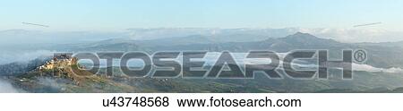Stock Photo - Sicily in springtime: Easter Culture, beaches, snow covered mountains, central landscapes, architecture shaped by the centuries, Italy. Fotosearch