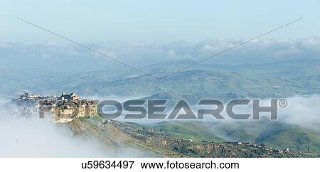 Stock Photo - Sicily in springtime: Easter Culture, beaches, snow covered mountains, central landscapes, architecture shaped by the centuries, Italy. Fotosearch
