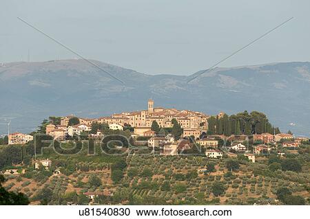 Stock Image - Umbrian medieval town of MonteCastello di Vibio, Italy at sunset. Fotosearch