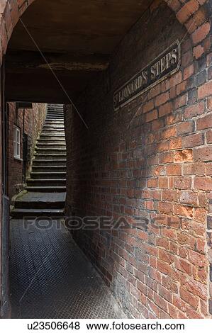 Stock Photo - Under the arch to the steps. Fotosearch