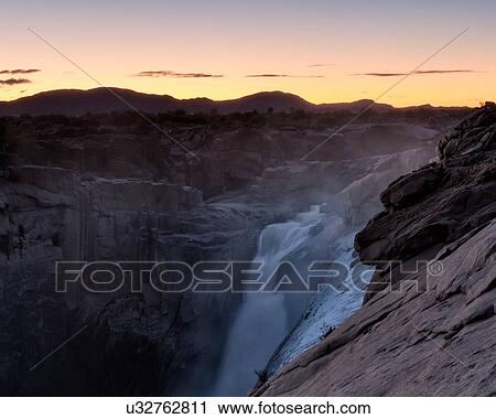 Waterfall at dawn View Large Photo Image Stock Image - Waterfall at dawn. Fotosearch