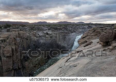 Stock Image - Waterfall at first light. Fotosearch
