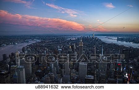 Stock Image - Aerial view of downtown district at sunset. Fotosearch