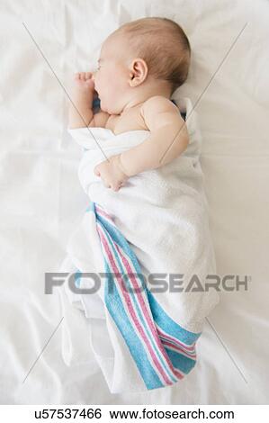 Baby girl (2-5 months) sleeping on bed View Large Photo Image Stock Photograph - Baby girl (2-5 months) sleeping on bed. Fotosearch