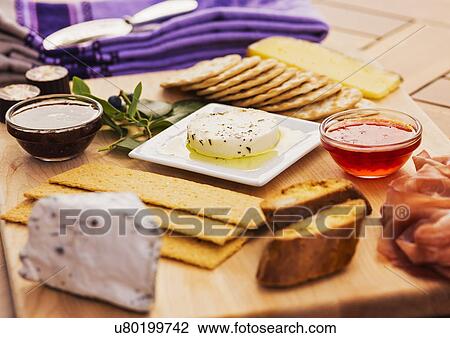Blue cheese snacks on cutting board View Large Photo Image Stock Image - Blue cheese snacks on cutting board. Fotosearch