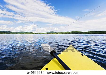 Bow of yellow kayak on lake View Large Photo Image Picture - Bow of yellow kayak on lake. Fotosearch