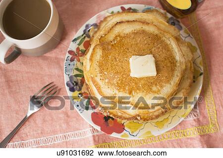 Stock Image - Breakfast with coffee and pancakes. Fotosearch