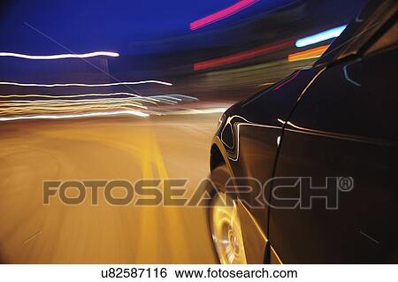 Car speeding at dusk View Large Photo Image Stock Photograph - Car speeding at dusk. Fotosearch
