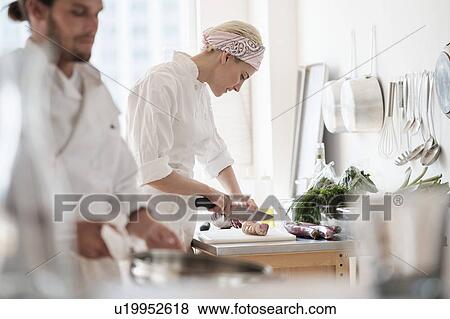 Stock Photo - Chefs working in kitchen. Fotosearch