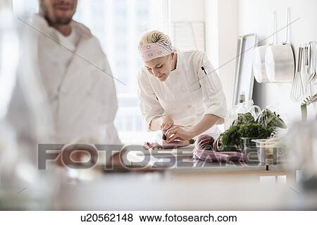 Stock Photo - Chefs working in kitchen. Fotosearch