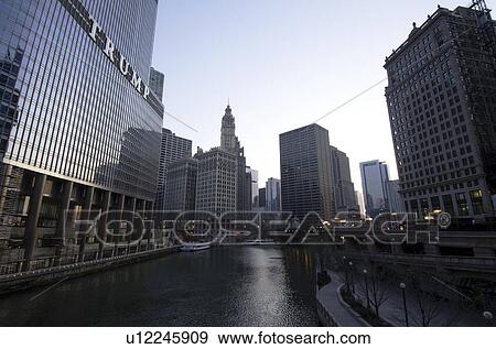 Chicago river flowing between skyscrapers View Large Photo Image Stock Photo - Chicago river flowing between skyscrapers. Fotosearch