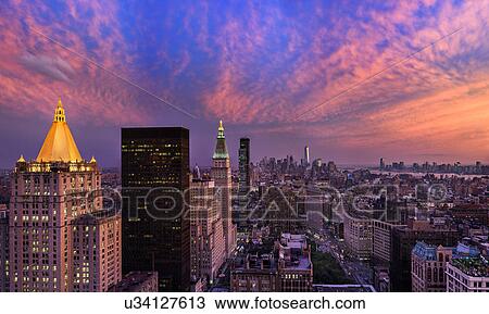 Stock Image - Cityscape at sunset. Fotosearch