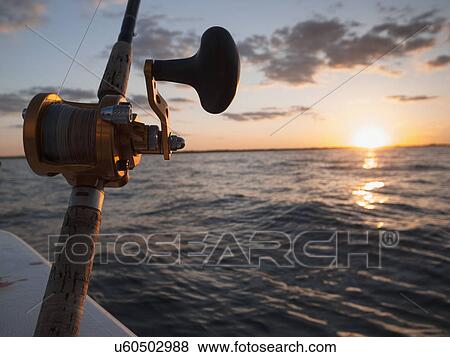 Close-up of fishing rod and reel View Large Photo Image Stock Photo - Close-up of fishing rod and reel. Fotosearch