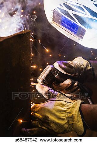Close-up of welder working View Large Photo Image Stock Image - Close-up of welder working . Fotosearch