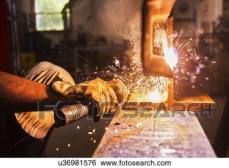 Stock Photograph - Close-up of welder working . Fotosearch