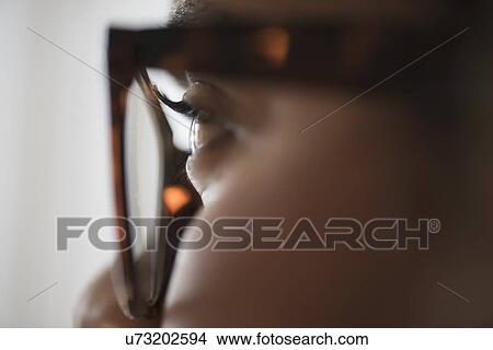Close up of young woman in nerdy glasses View Large Photo Image Picture - Close up of young woman in nerdy glasses. Fotosearch