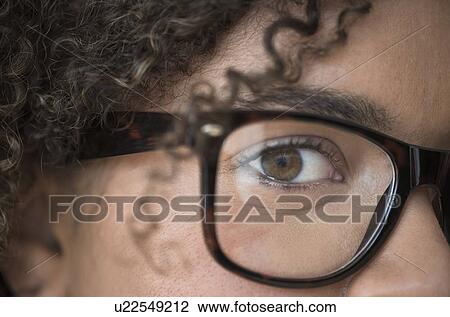 Close up of young woman in nerdy glasses View Large Photo Image Stock Image - Close up of young woman in nerdy glasses. Fotosearch