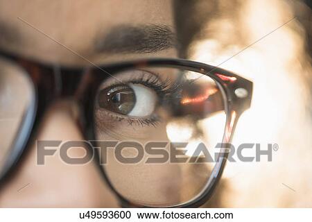 Close up of young woman in nerdy glasses View Large Photo Image Stock Image - Close up of young woman in nerdy glasses. Fotosearch