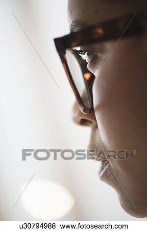 Close up of young woman in nerdy glasses View Large Photo Image Stock Photo - Close up of young woman in nerdy glasses. Fotosearch