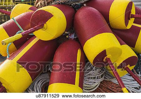 Stock Photo - Colorful buoys and ropes . Fotosearch