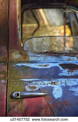 Stock Image - Colorful door of abandoned truck . Fotosearch