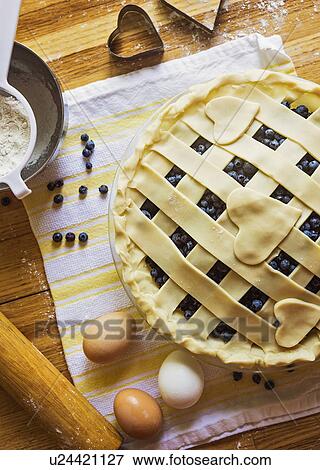 Stock Photo - Cooking berry pie. Fotosearch
