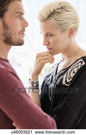 Stock Image - Couple arguing in living room. Fotosearch