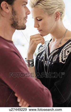Couple arguing in living room View Large Photo Image Stock Photo - Couple arguing in living room. Fotosearch