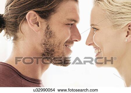 Couple face to face on white background View Large Photo Image Picture - Couple face to face on white background. Fotosearch