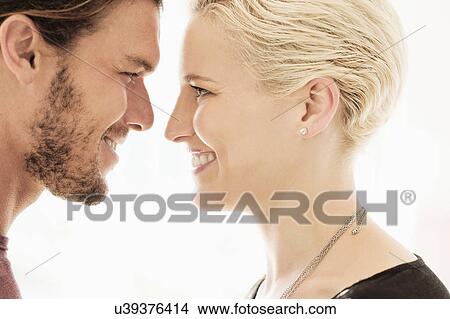 Couple face to face on white background View Large Photo Image Picture - Couple face to face on white background. Fotosearch
