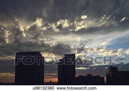 Dramatic sky over Downtown District at dusk View Large Photo Image Stock Image - Dramatic sky over Downtown District at dusk. Fotosearch