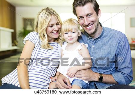 Stock Image - Family portrait with daughter (2-3). Fotosearch