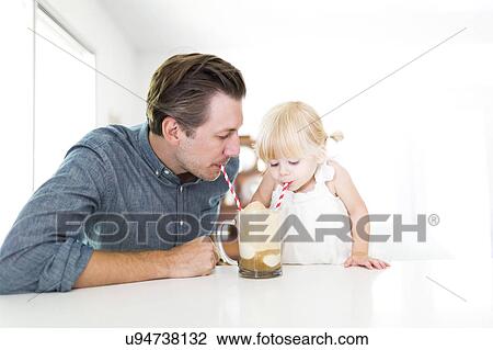 Father drinking milkshake with daughter (2-3) View Large Photo Image Stock Image - Father drinking milkshake with daughter (2-3). Fotosearch