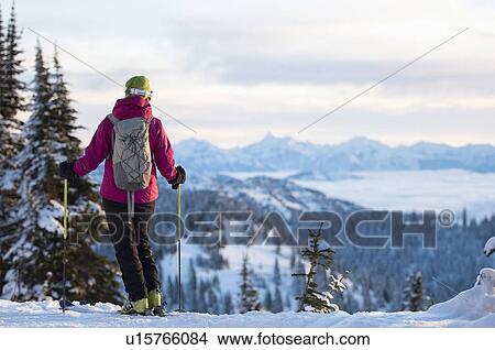 Female skier against mountains View Large Photo Image Picture - Female skier against mountains. Fotosearch