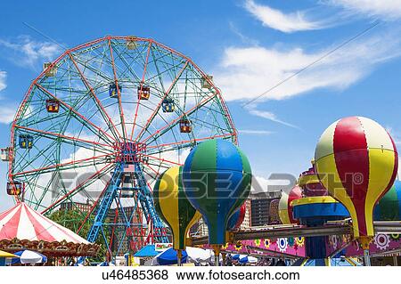 Stock Photo - Ferris wheel against blue sky. Fotosearch