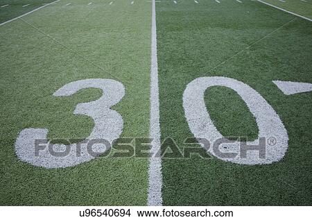 Picture - Football field marking of 30 yard line. Fotosearch