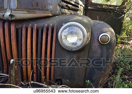Stock Image - Front of rusty abandoned car. Fotosearch