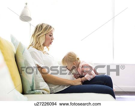 Girl (2-3) kissing belly of mother View Large Photo Image Picture - Girl (2-3) kissing belly of mother. Fotosearch