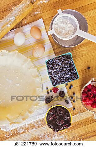 Stock Photo - Ingredients for berry pie on table. Fotosearch