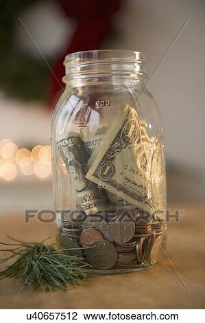 Jar with dollar bills and coins View Large Photo Image Stock Image - Jar with dollar bills and coins. Fotosearch