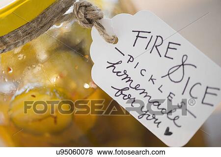 Jar with spicy pickles and hand written tag View Large Photo Image Stock Photo - Jar with spicy pickles and hand written tag. Fotosearch