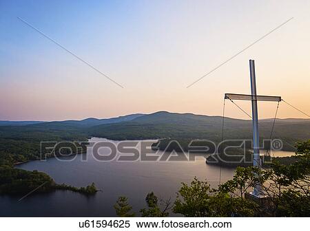Stock Photography - Landscape with cross at dusk. Fotosearch