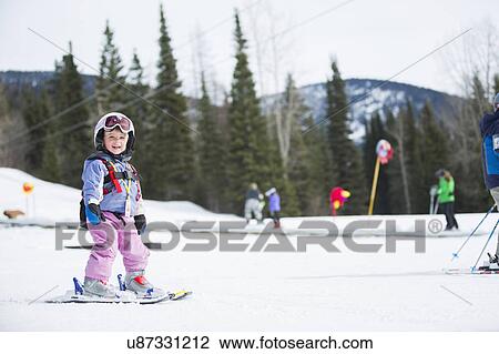 Little girl (2-3) learning skiing View Large Photo Image Stock Image - Little girl (2-3) learning skiing . Fotosearch