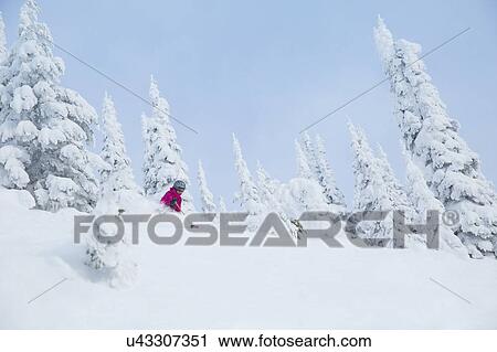 Low angle view of mature woman on ski slope View Large Photo Image Stock Image - Low angle view of mature woman on ski slope . Fotosearch
