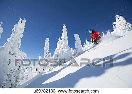 Low angle view of mature woman on ski slope View Large Photo Image Stock Image - Low angle view of mature woman on ski slope . Fotosearch
