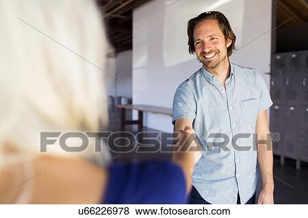 Man and woman shaking hands View Large Photo Image Stock Photo - Man and woman shaking hands. Fotosearch
