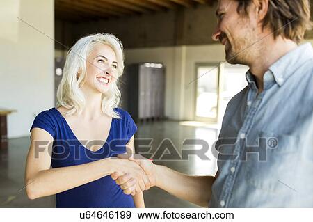 Stock Photo - Man greeting with woman. Fotosearch