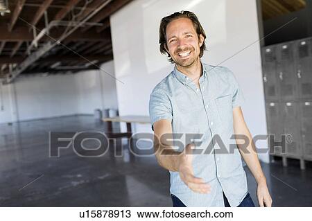 Stock Image - Man in warehouse. Fotosearch
