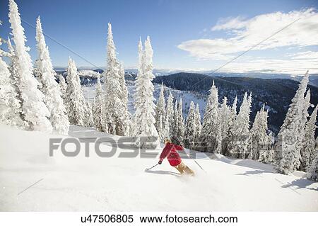 Man skiing downhill View Large Photo Image Stock Photography - Man skiing downhill. Fotosearch