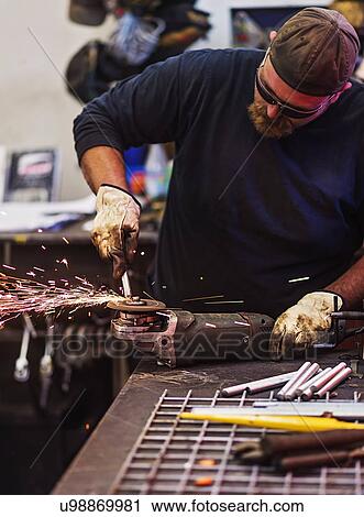 Man using circular saw in workshop View Large Photo Image Stock Image - Man using circular saw in workshop. Fotosearch
